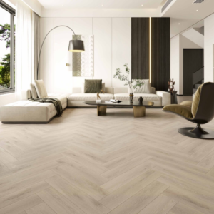 Close-up overhead view of Mazon Milano Herringbone laminate flooring in Piazza Oak, showing detailed wood grain and AC5 texture.